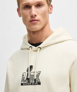 Hugo Boss Tracksuits-BOSS x NFL stretch hoodie with gold-tone artwork-hugo boss store 2