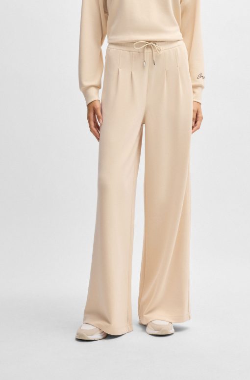 Hugo Boss-Wide-leg tracksuit bottoms with pleat details-hugo boss near me