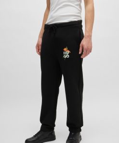 Hugo Boss Sweatshirts and Jogging Pants-Relaxed-fit tracksuit bottoms with floral logo artwork-boss store near me