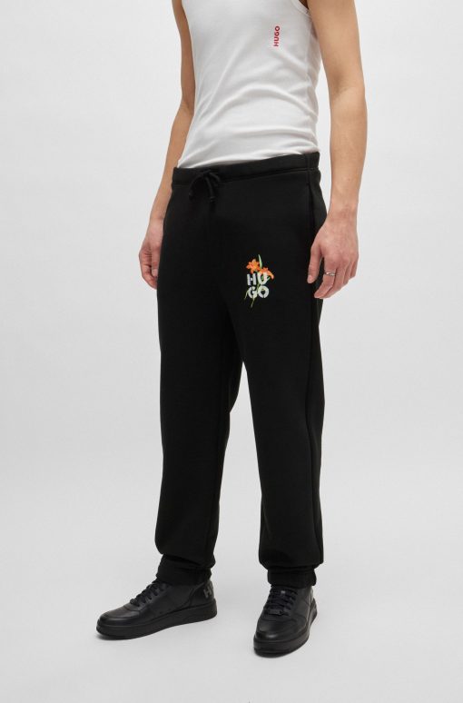 Hugo Boss Sweatshirts and Jogging Pants-Relaxed-fit tracksuit bottoms with floral logo artwork-boss store near me