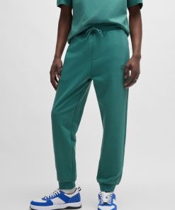 Hugo Boss Sweatshirts and Jogging Pants-Cotton-terry tracksuit bottoms with Happy HUGO logo patch-hugo boss near me