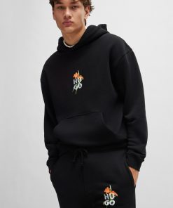 Hugo Boss Sweatshirts and Jogging Pants-Relaxed-fit tracksuit bottoms with floral logo artwork-boss store near me 2