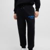 Hugo Boss Sweatshirts and Jogging Pants-Cotton-terry tracksuit bottoms with Happy HUGO logo-hugo by hugo boss 3