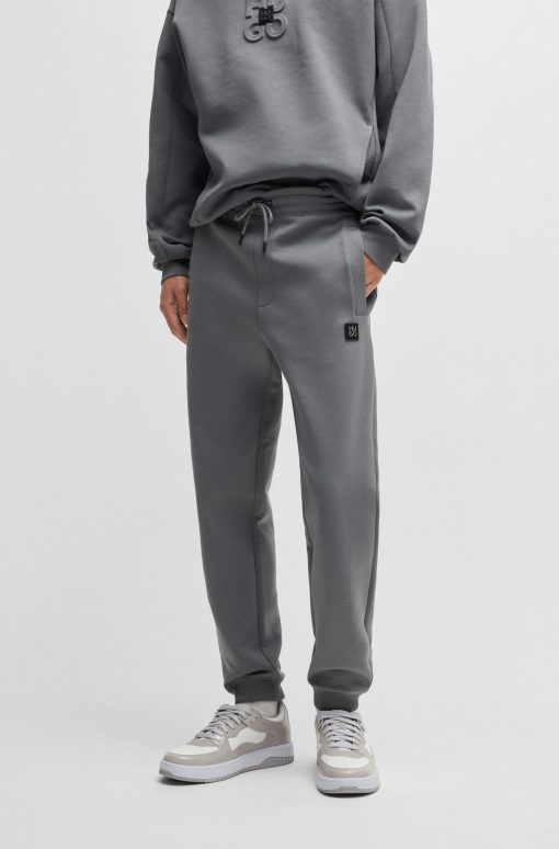 Hugo Boss Sweatshirts and Jogging Pants-Cotton tracksuit bottoms with stacked logo-hugo boss near me